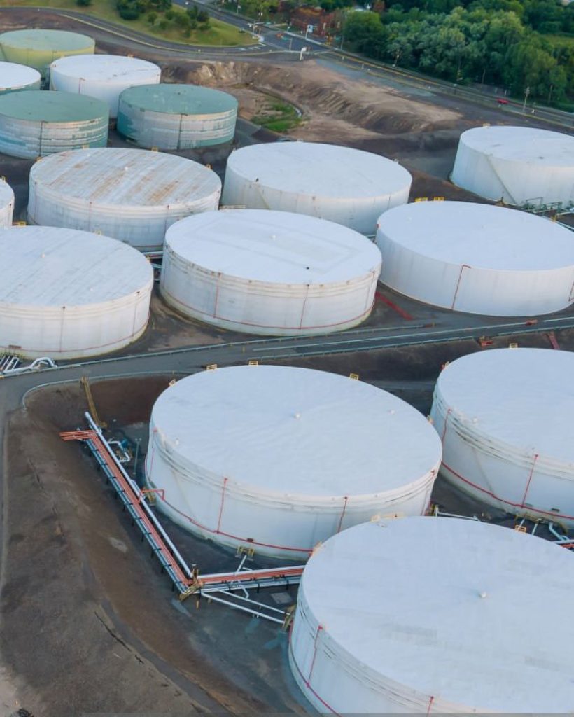 Aerial view close up Industrial view at oil refinery plant form industry zone with oil tank